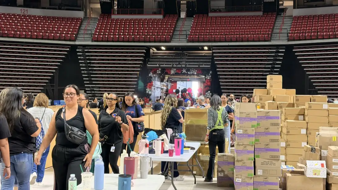 Families and volunteers during the Pack the Mack giveaway.